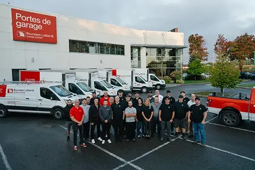 Employees of a company in front of their trucks